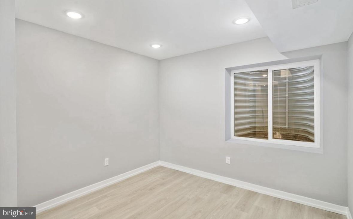 2426 Jasper Street, Unit A Philadelphia, PA 19125 - Photo 8 of 19 an empty room with a window