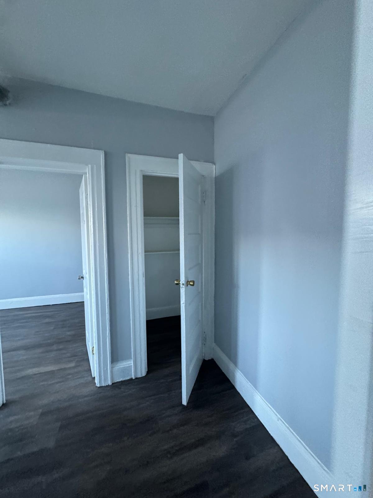159 Charles Street Bridgeport, CT 06606 - Photo 4 of 4 a view of an empty room with wooden floor