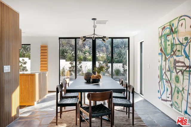 a dining room with furniture window wooden floor