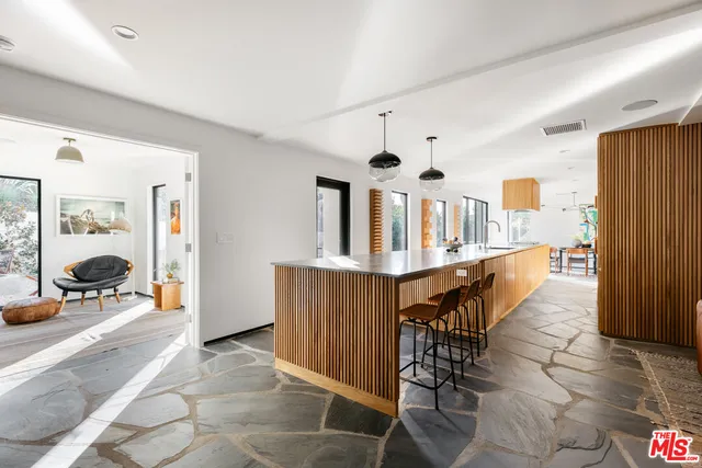 a view of a living room and kitchen