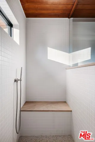 a spacious bathroom with a double vanity sink and a mirror