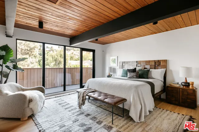 a bathroom with a shower and a sink