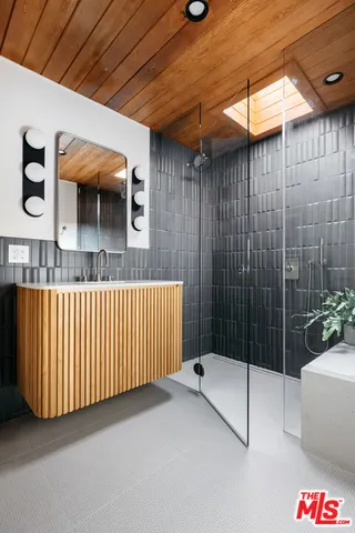 a bathroom with a sink and a shower curtain