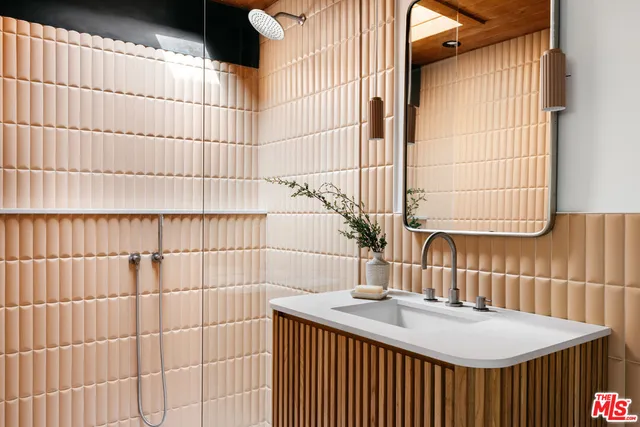 a view of a balcony with furniture and a yard