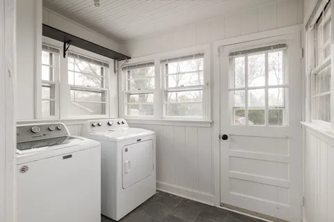 a view of hallway with washer and dryer