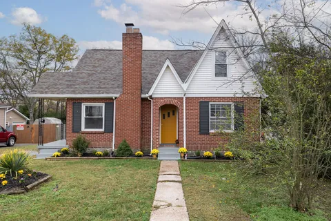 a view of balcony with wooden floor and outdoor seating