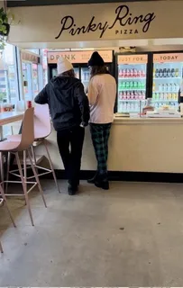 a view of a dining room with furniture and window