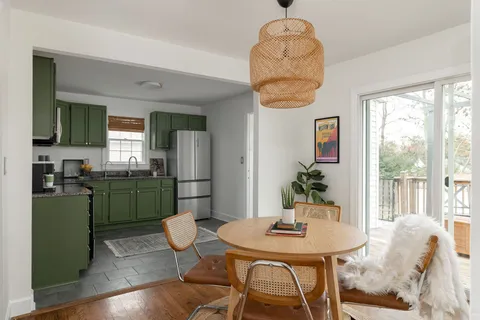 a kitchen with a table and chairs