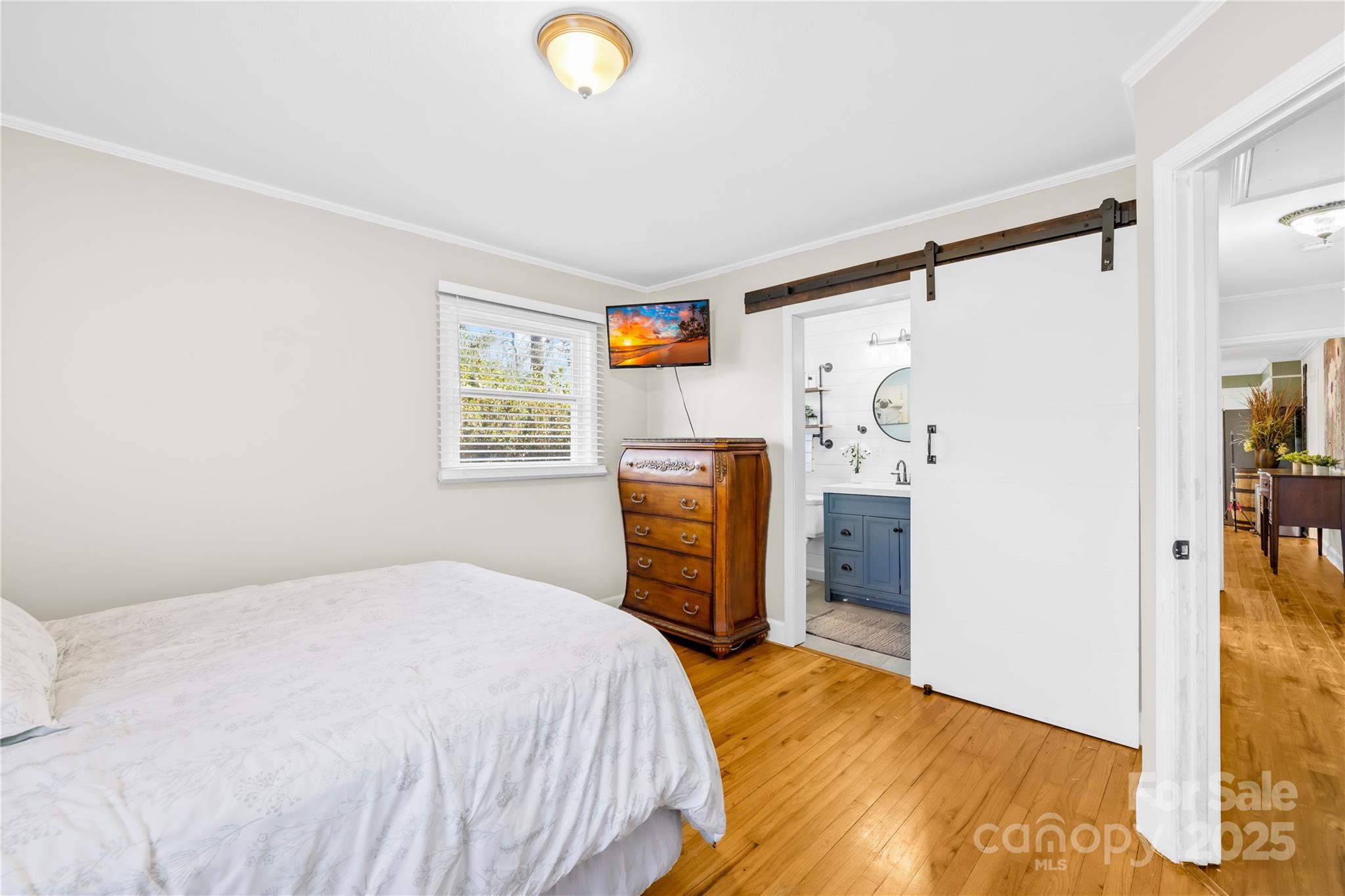 827 Lakeside Circle Lancaster, SC 29720 - Photo 16 of 31 a bedroom with a bed and a flat tv screen on the dresser