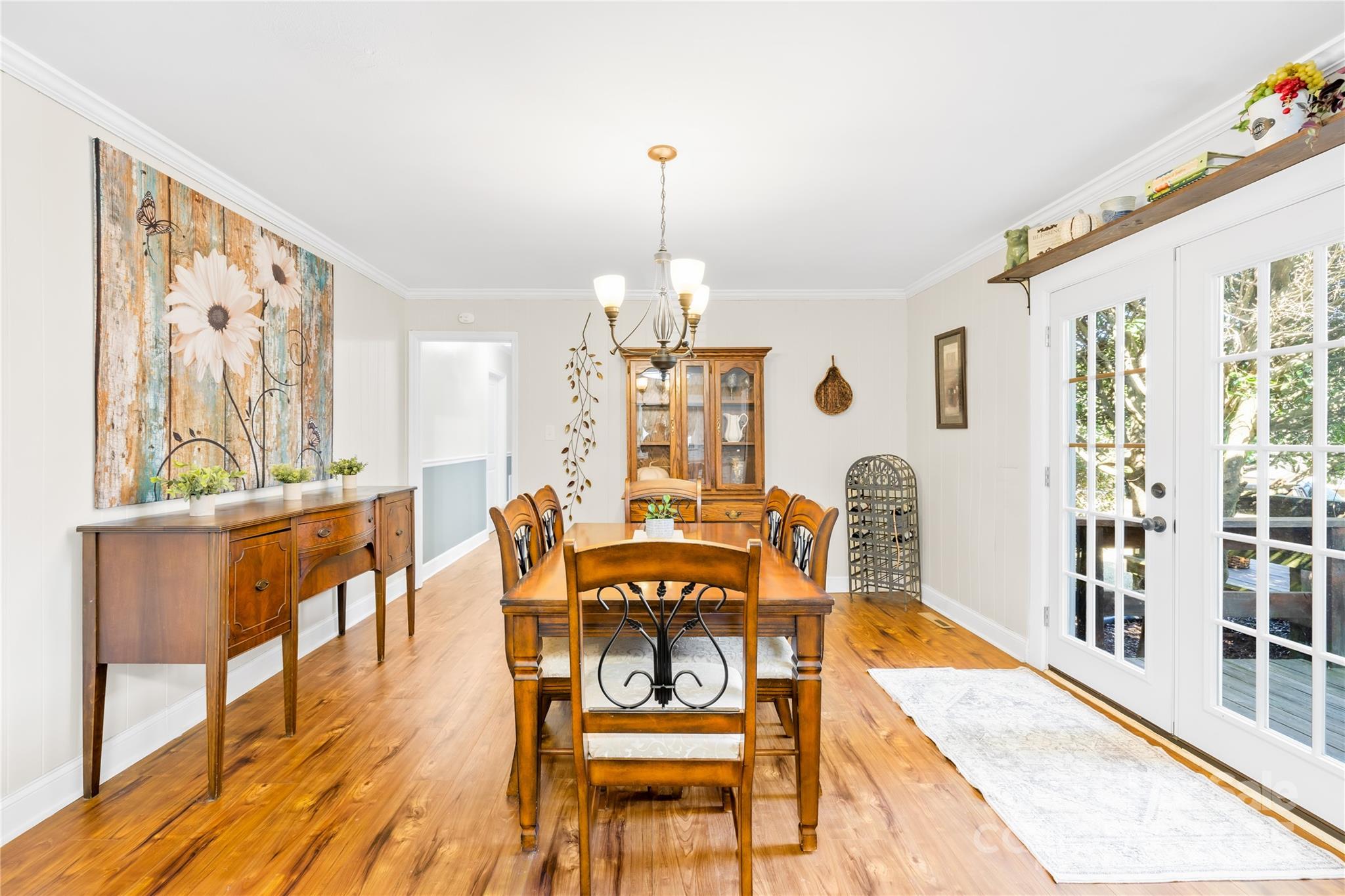 827 Lakeside Circle Lancaster, SC 29720 - Photo 20 of 31 a view of a dining room with furniture window and wooden floor