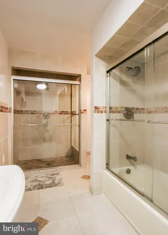 a bathroom with a toilet sink and shower