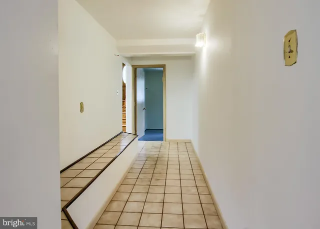 a view of a house with a big yard and potted plants