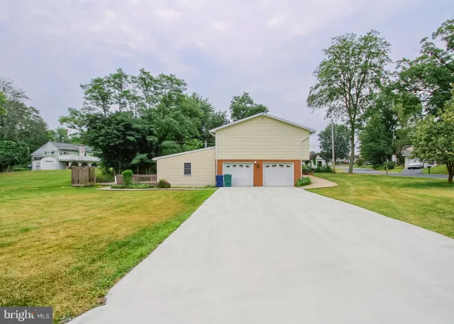 a backyard of a house with lots of green space