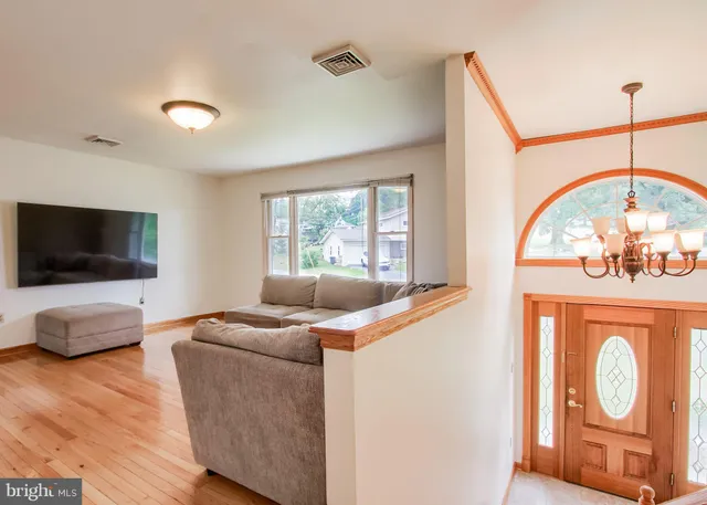 a kitchen with granite countertop stainless steel appliances a stove a sink and a refrigerator