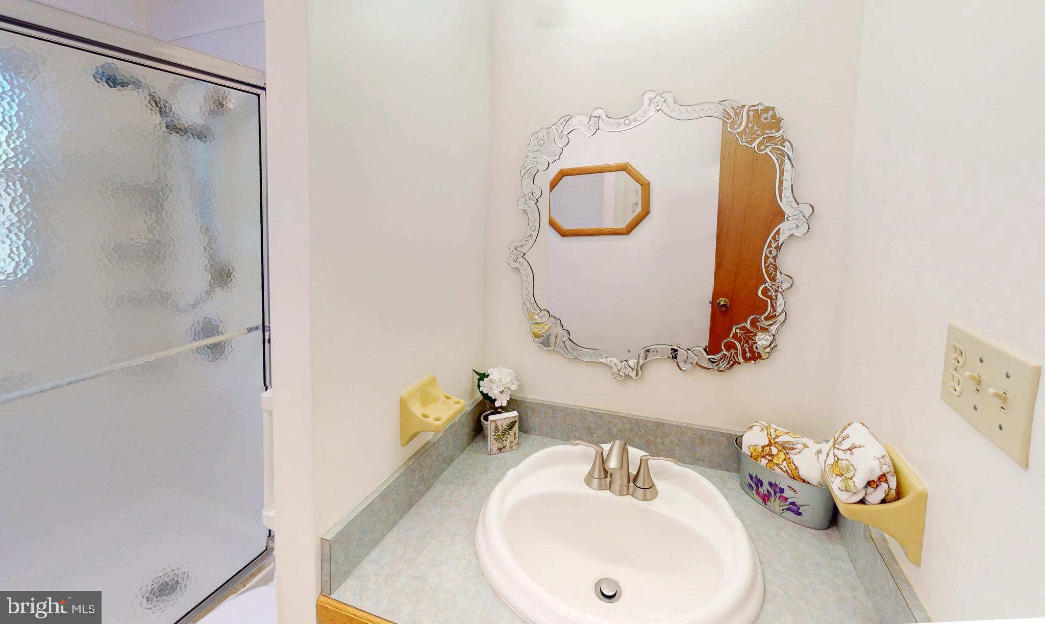 3721 Nile Road Davidsonville, MD 21035 - Photo 15 of 34 Lovely decorative mirror in the main level bath.