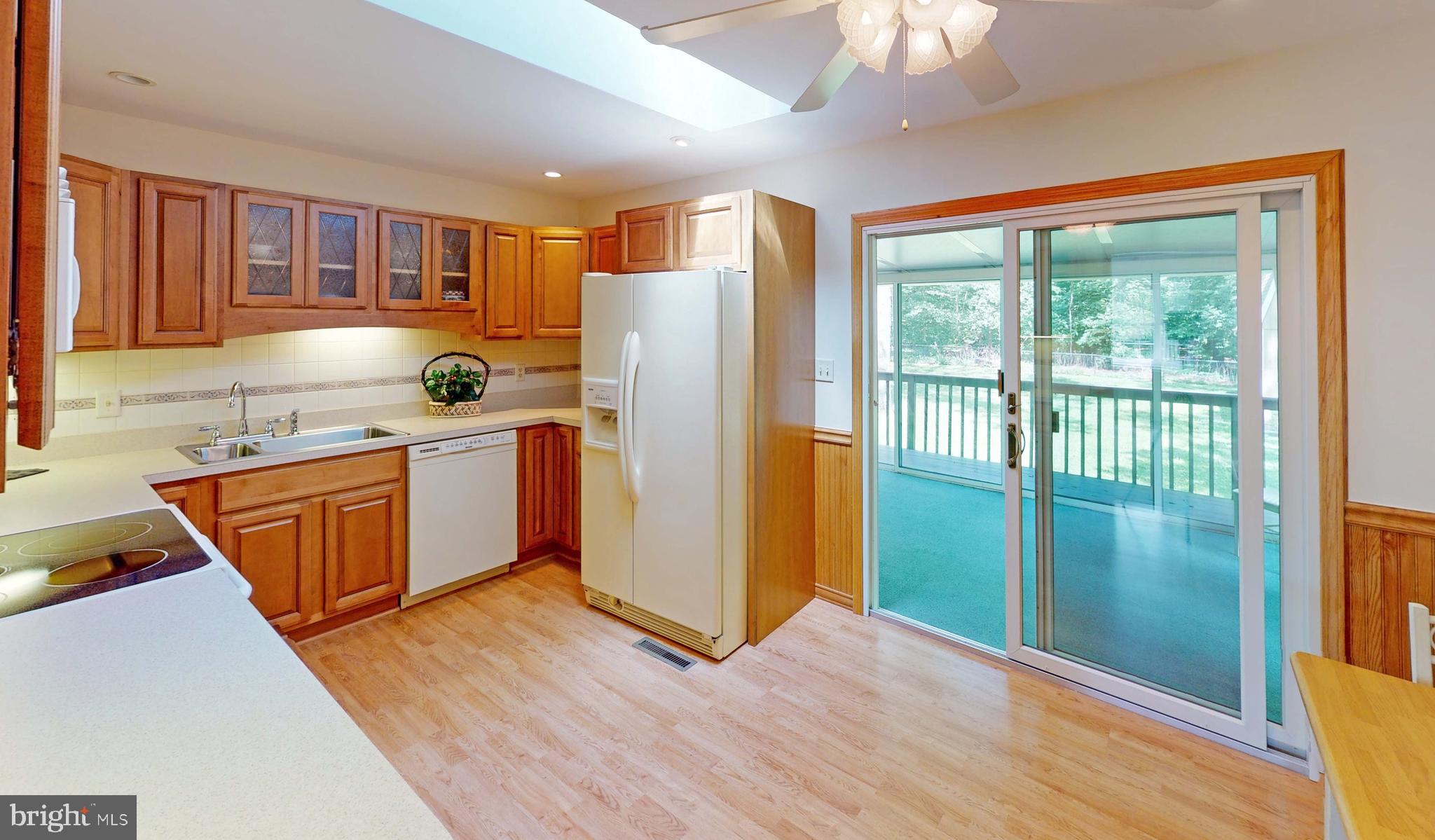 3721 Nile Road Davidsonville, MD 21035 - Photo 8 of 34 Light streams in from sliding doors to sunroom!