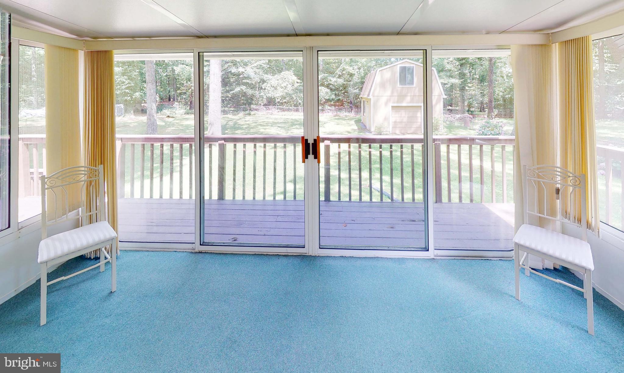 3721 Nile Road Davidsonville, MD 21035 - Photo 10 of 34 Sunroom is full of windows with door to the deck.