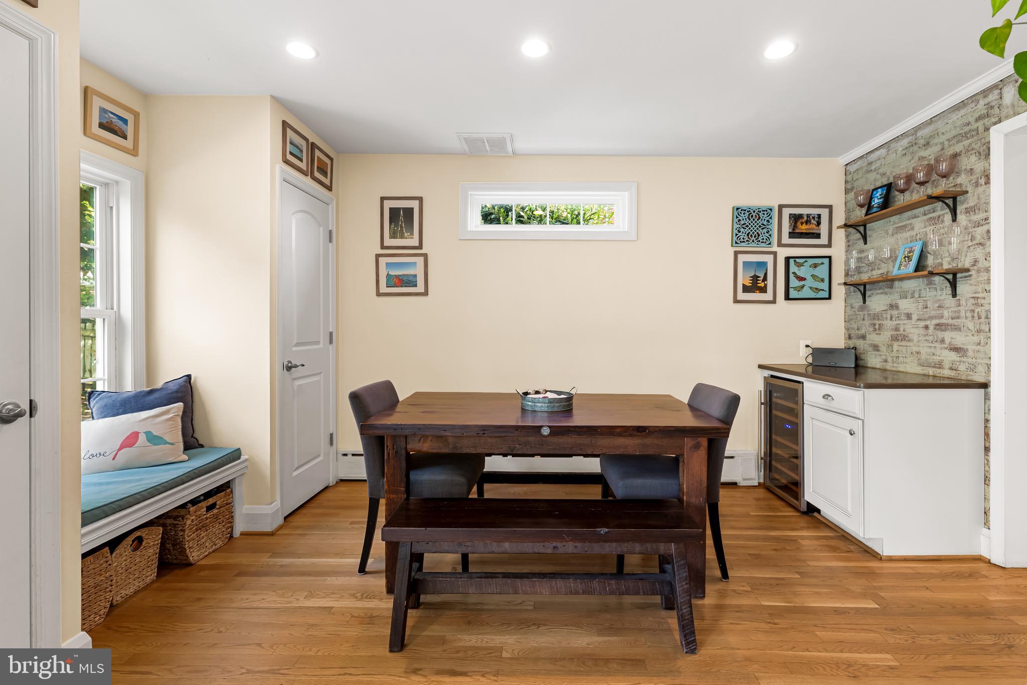 700 Regester Avenue Baltimore, MD 21212 - Photo 12 of 43 a view of a dining room with furniture wooden floor and a rug