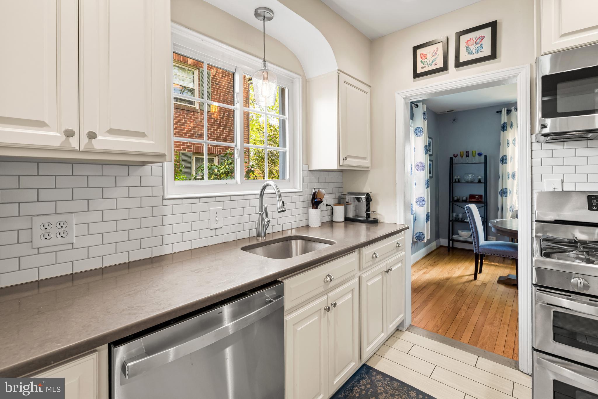 700 Regester Avenue Baltimore, MD 21212 - Photo 15 of 43 a kitchen with a sink cabinets and window