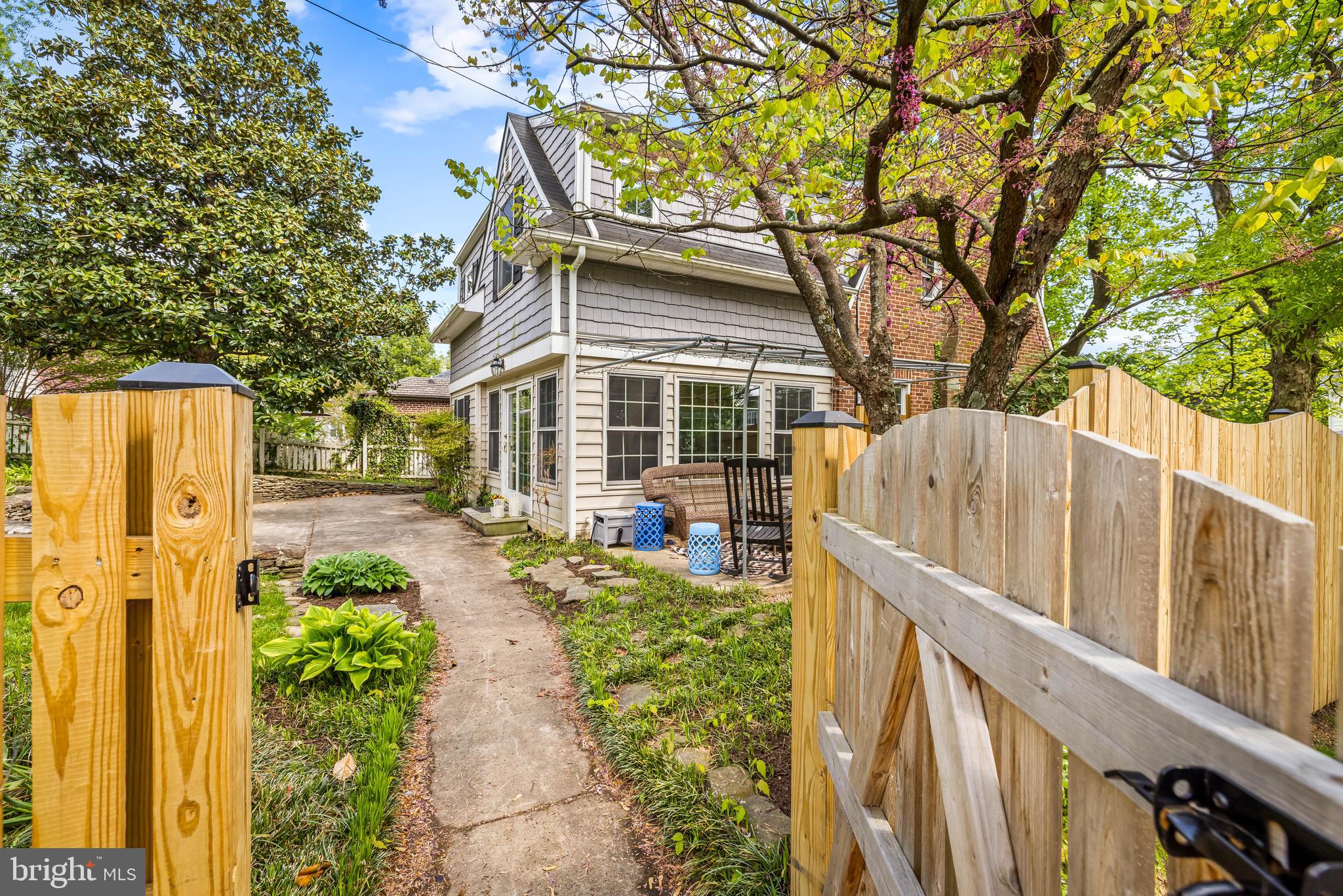 700 Regester Avenue Baltimore, MD 21212 - Photo 2 of 43 a view of a house with large windows and a small yard