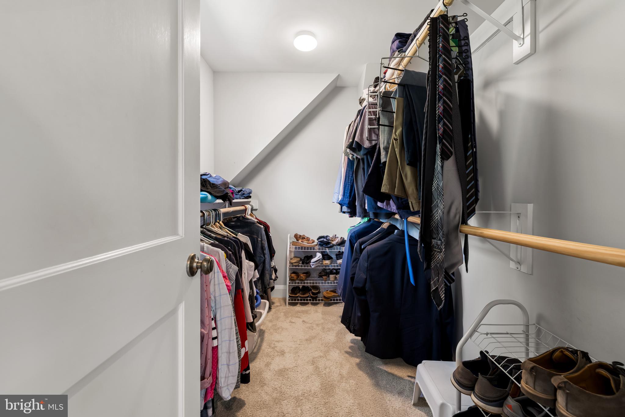 700 Regester Avenue Baltimore, MD 21212 - Photo 33 of 43 a view of walk in closet with clothes and shoes
