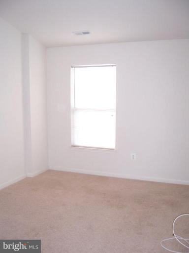729 Compass Road East Middle River, MD 21220 - Photo 6 of 10 a view of an empty room with a window