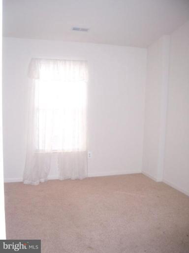 729 Compass Road East Middle River, MD 21220 - Photo 7 of 10 a view of an empty room and window