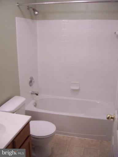 729 Compass Road East Middle River, MD 21220 - Photo 8 of 10 a bathroom with a sink a toilet and bathtub