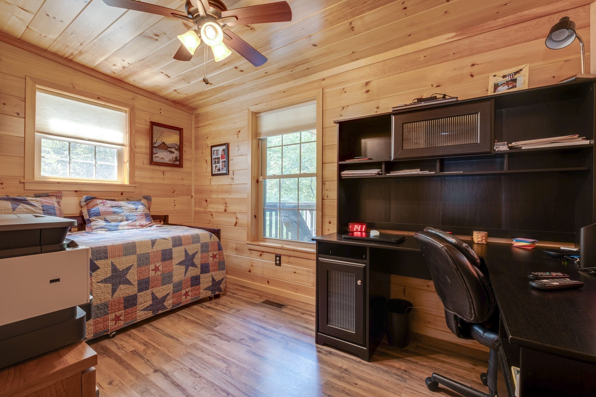 2614 Distillery Road Greenbrier, TN 37073 - Photo 24 of 34 a bedroom with a bed and wooden floor