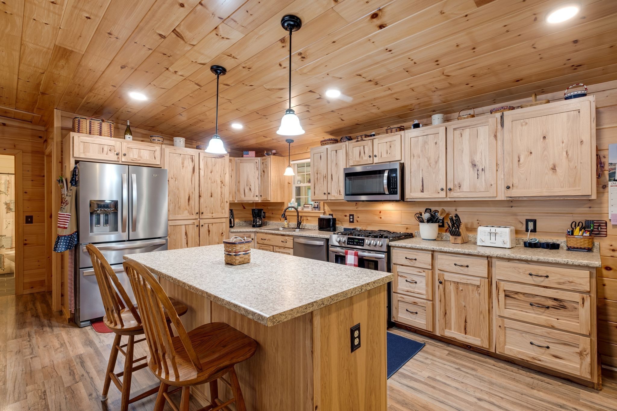 2614 Distillery Road Greenbrier, TN 37073 - Photo 9 of 34 a kitchen with stainless steel appliances stove refrigerator dining table and chairs