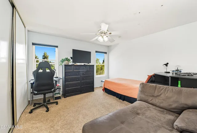 a bedroom with a bed and furniture