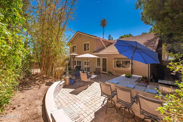 swimming pool view with a seating space