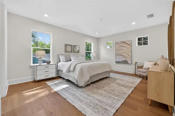 a bedroom with a bed and window