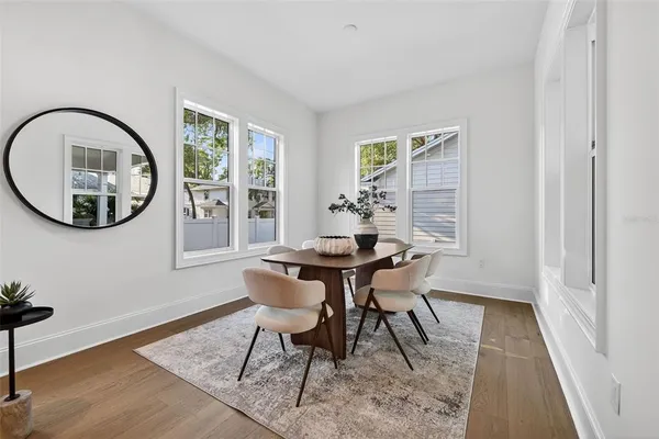 a kitchen with cabinets a sink a center island and stainless steel appliances