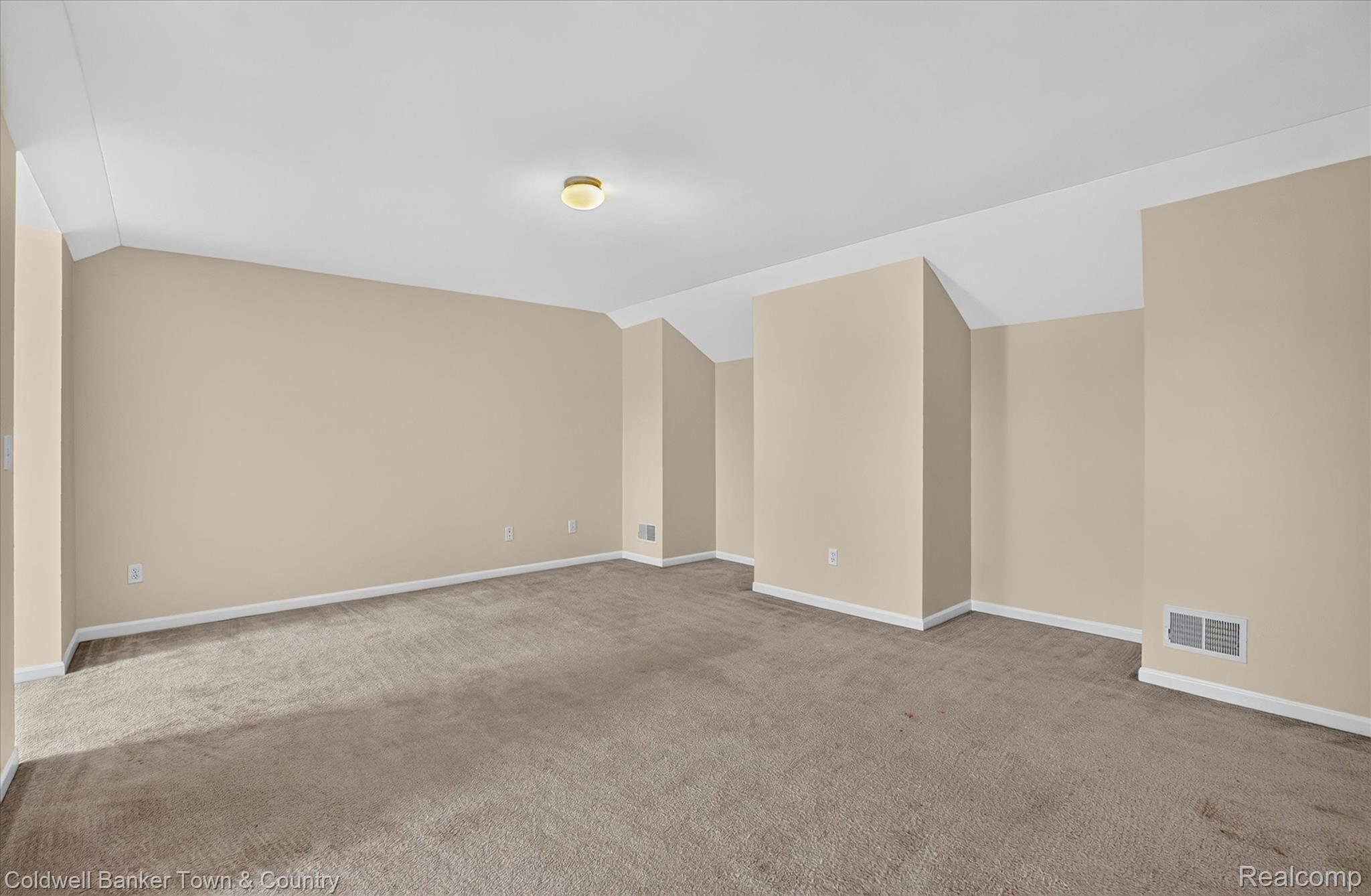 1725 Town Commons Drive Howell, MI 48855 - Photo 42 of 53 Spacious room featuring neutral carpeting and light-toned walls