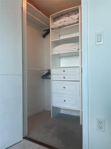 a view of an empty walk in closet