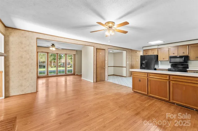 a view of a kitchen with a sink and cabinet