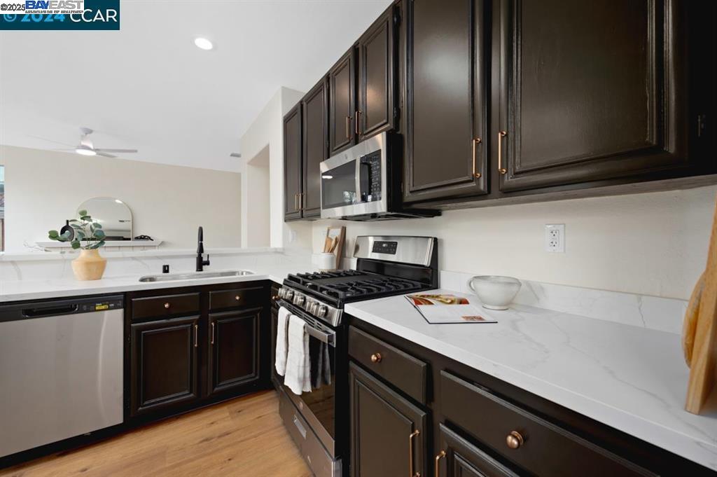 4433 Whitehoof Way Antioch, CA 94531 - Photo 12 of 31 a kitchen with stainless steel appliances a sink stove and microwave