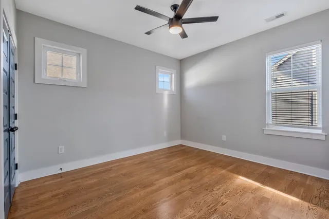 a view of room with window and ceiling fan