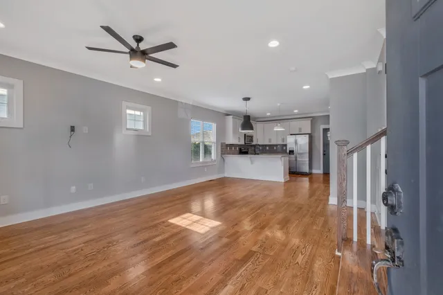 a view of a kitchen with a sink and a window