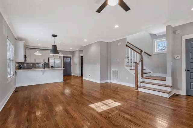a view of kitchen with cabinets and wooden floor