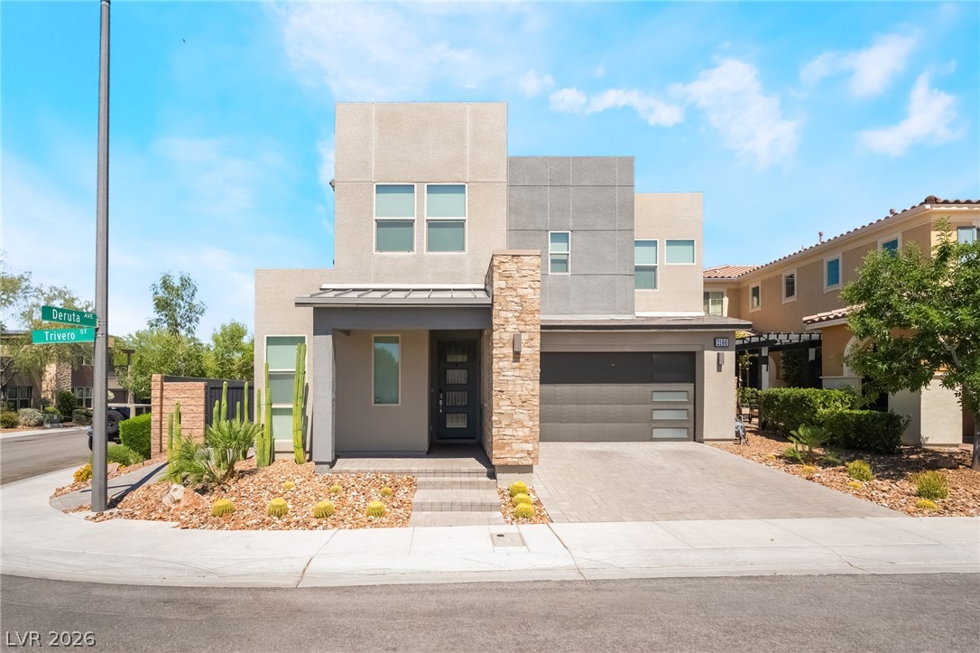 2166 Trivero Street Henderson, NV 89044 - Photo 1 of 61 A striking contemporary residence boasts a sleek facade and desert-friendly landscaping.