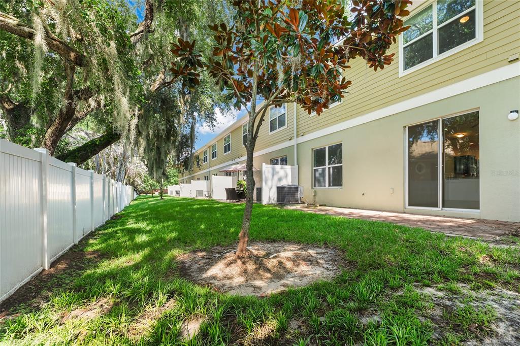 4824 Poolside Drive St. Cloud, FL 34769 - Photo 26 of 29 a front view of a house with garden
