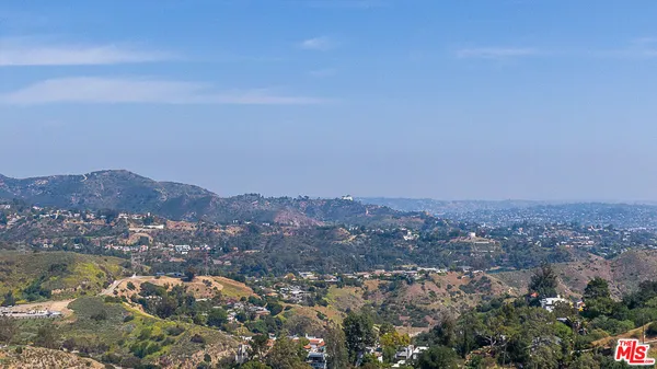 an aerial view of residential house and green space