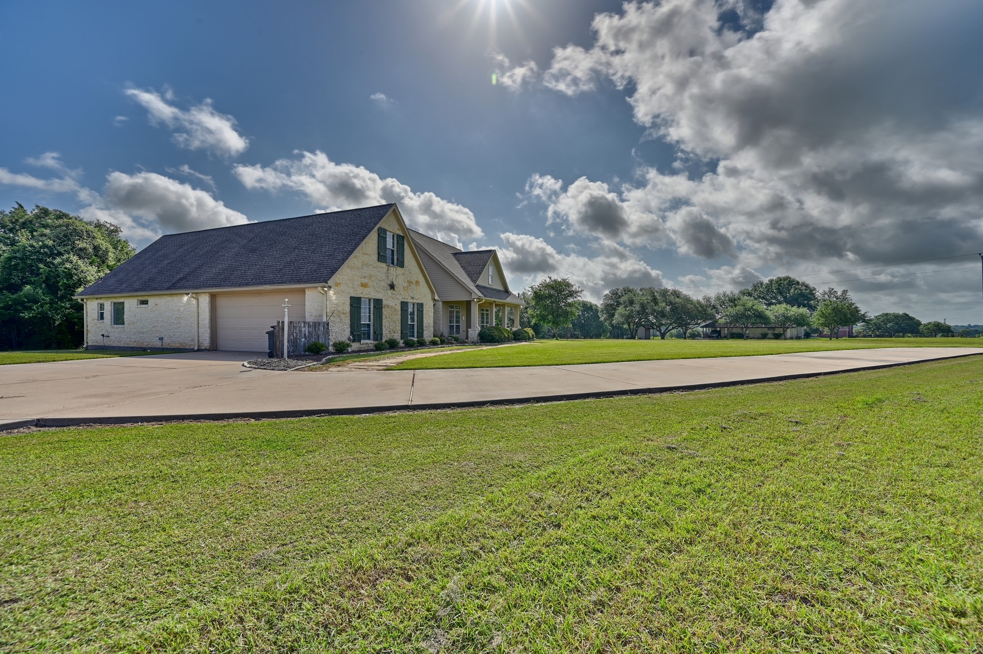 1205 Pecan Glen Road Brenham, TX 77833 - Photo 7 of 40 Travel up the driveway to the house, barn and extra paved parking