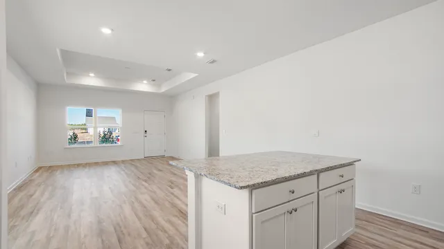 a view of storage and utility room with wooden floor
