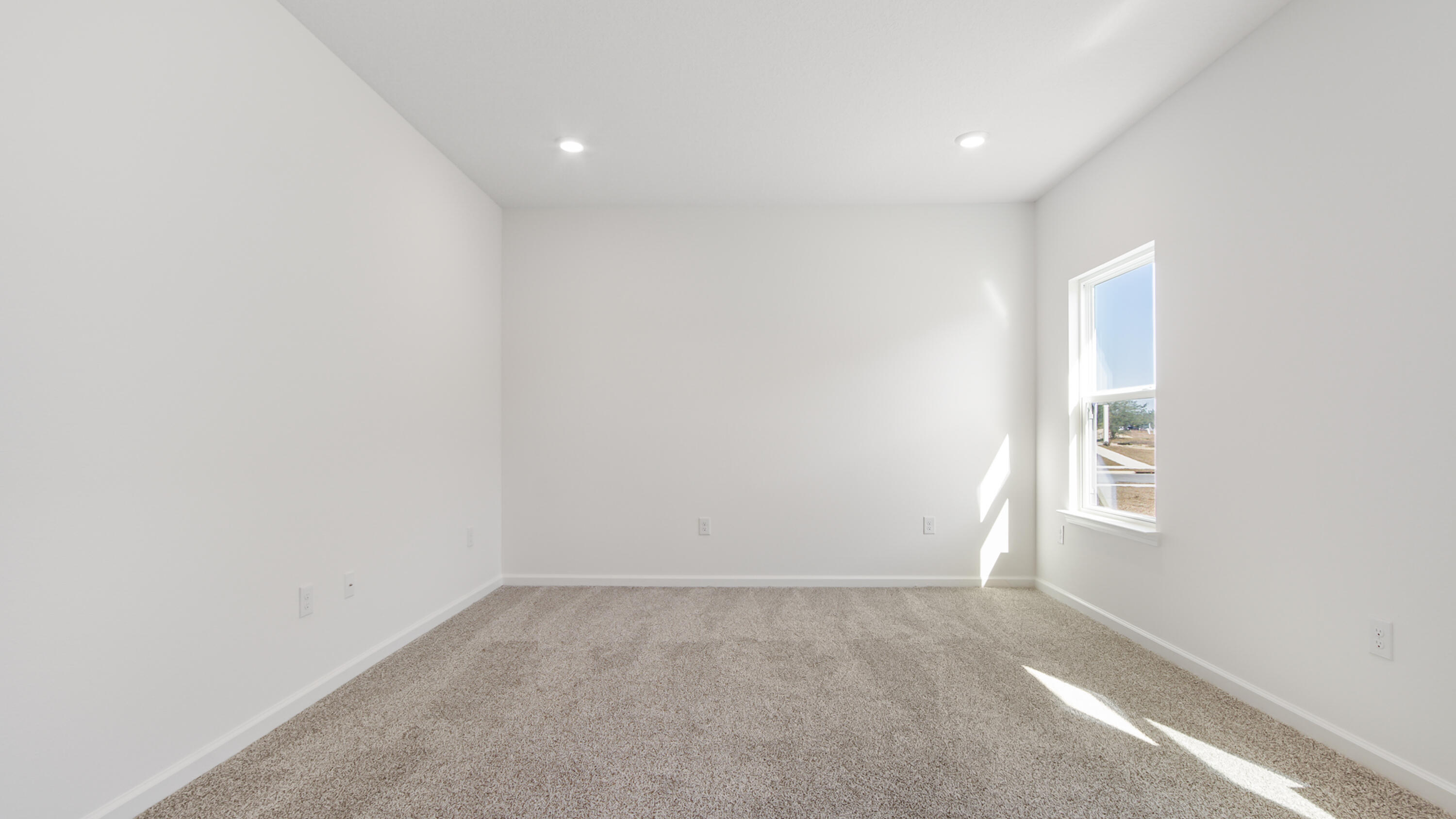 180 Huckleberry Street Freeport, FL 32439 - Photo 16 of 33 an empty room with windows