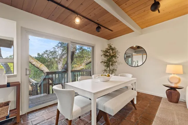 a view of a dining room with furniture window and outside view