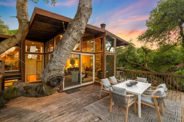 a view of a chairs and table in the patio