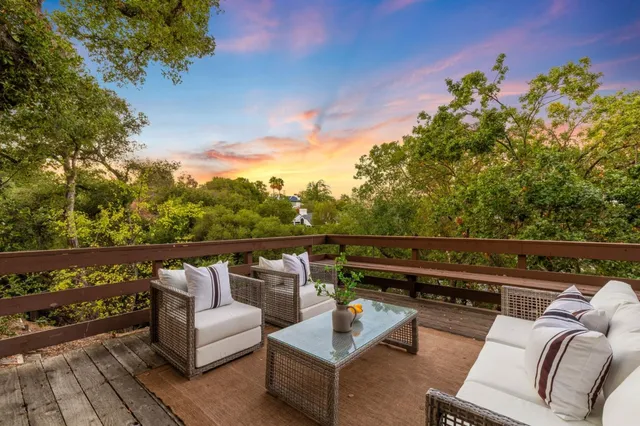 a view of outdoor sitting area with furniture